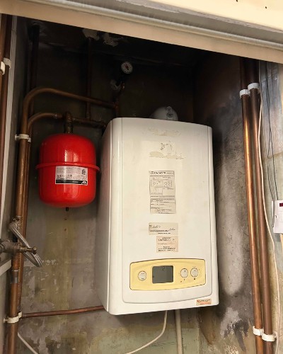 Time-Sensitive Boiler Upgrade for Local Housing Charity Before - Buckinghamshire Heating